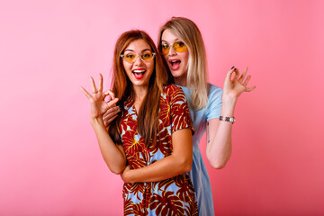 Two happy pretty sisters best friends hipster women having fun together