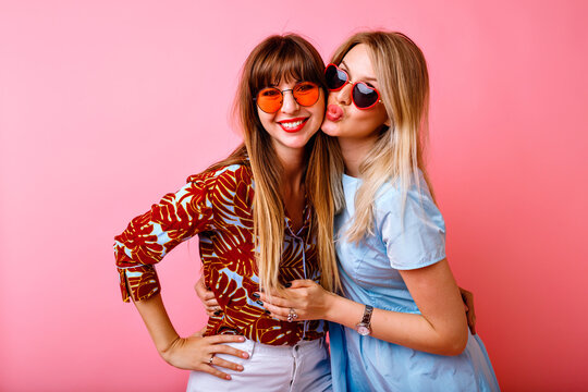 Two happy pretty sisters best friends hipster women having fun together