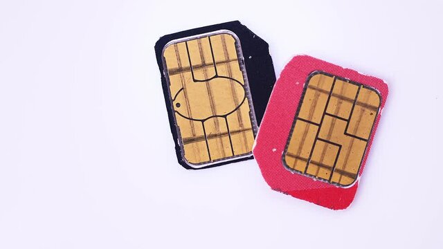 used SIM cards of mobile operators rotate close-up