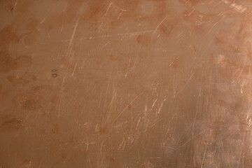 Textolite surface with a copper foil. Brazen background from metal-clad glass textolite. Fingerprints. Copy space.