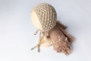 blue knitted hat and diaper for the baby. beige fabric jersey