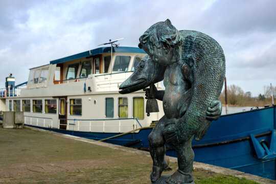 Boy with the fish at the IJsselkade in Kampen, Overijssel province, The Netherlands