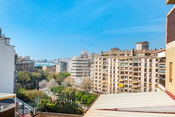view between buildings in the city of Palma de Mallorca, blue sky