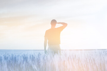 Man silhouette and field, sky soft landscape. Light delicate pastel color tone. Nature horizontal background. - obrazy, fototapety, plakaty