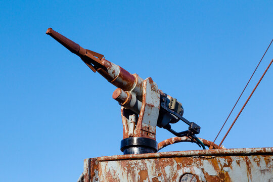 Southern Ocean, South Georgia, King Edward Cove, Grytviken, Grytviken whaling station. A rusted harpoon gun remains on the old ship.