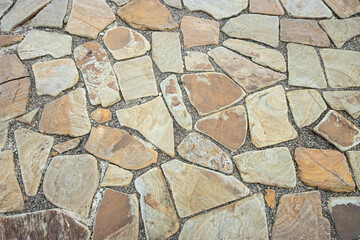 texture of beige stone-paved pathway