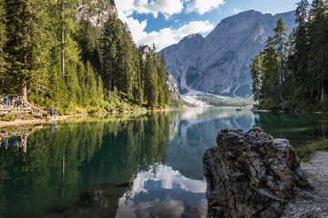 Fototapeta na wymiar Sunny day on Lake Braies in Dolomites in Italy