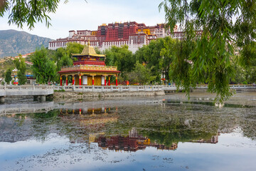 Potala Palace (UNESCO World Heritage site) with reflection in the lake water, Lhasa, Tibet, China