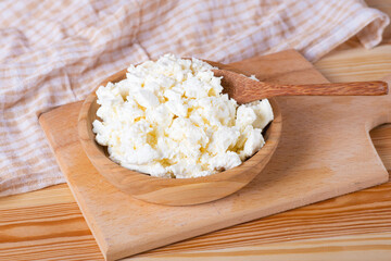 cottage cheese in a wooden bowl