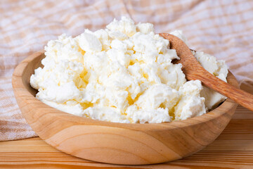 cottage cheese in a wooden bowl