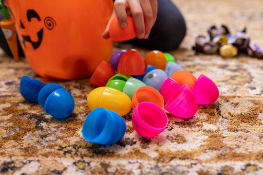 Many Open Plastic Easter Eggs On A Rug