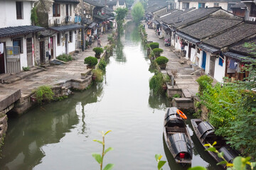 Fototapeta na wymiar Rowing Wupeng boat on the Grand Canal, Shaoxing, Zhejiang Province, China