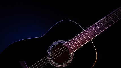 Obraz na płótnie Canvas black guitar front view close-up. guitar music low-key concept