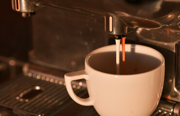 Coffee time. Making a cup of cappuccino at an espresso professional machine. One of the most favorite drinks in the world. Coffee speciality.