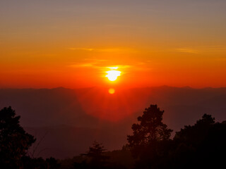 sunset in sky clouds and mountain background