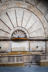 Pigeon exploring the Monumental Fountain of Mouzinho da Silveira in Porto