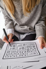 Woman designer create website design wireframe. Sketch, prototype, framework, layout future design...