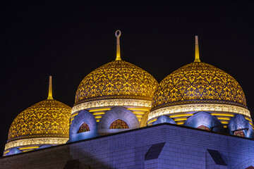 Middle East, Arabian Peninsula, Oman, Muscat, Bawshar. Evening view of the Muhammad Al Ameen Mosque...