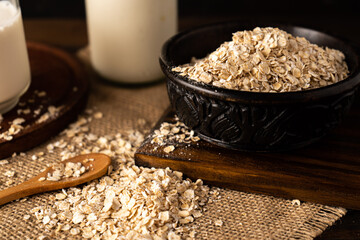 Close-up of a bowl with oatmeal on a kitchen table. Chopped sight.