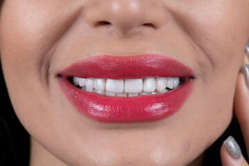 Fototapeta premium beautiful white smile with lipstics