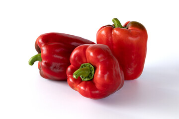 pile of red peppers isolated on white background
