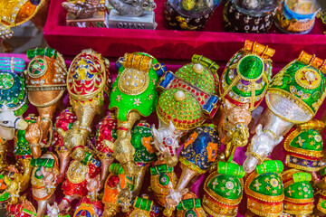 Middle East, Arabian Peninsula, Oman, Muscat, Muttrah. Decorative camels at the market in Muttrah.