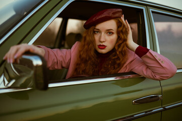 Fashionable elegant confident redhead woman with marsala color lips, eyes makeup, wearing faux...