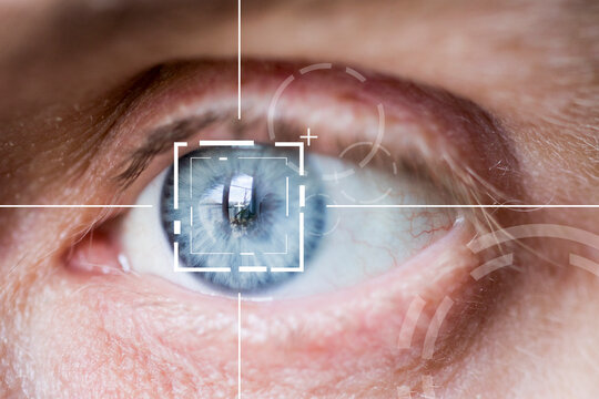 Eye monitoring and eye scan. Biometric iris virtual  scan of male eye close up.