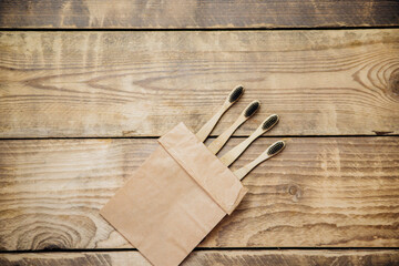 Eco-friendly bamboo toothbrushes in a craft bag. The concept of zero waste without plastic.