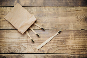 Eco-friendly bamboo toothbrushes in a craft bag. The concept of zero waste without plastic.