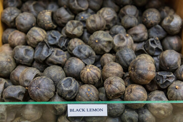 Middle East, Arabian Peninsula, Oman, Ad Dakhiliyah, Nizwa. Dried black lemons for sale in the souk in Nizwa, Oman.