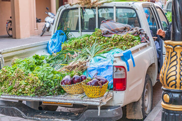 Middle East, Arabian Peninsula, Oman, Ad Dakhiliyah, Nizwa. Vegetables being sold from the back of...