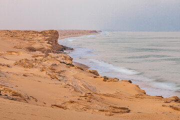 Middle East, Arabian Peninsula, Ash Sharqiyah North, Jalan Bani Buali. Surf on the coast of the Arabian Sea in Oman.