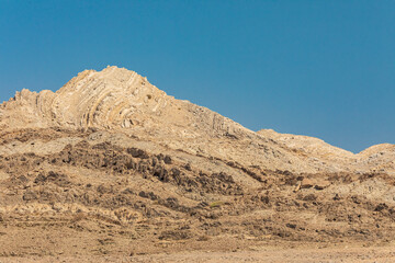 Middle East, Arabian Peninsula, Ash Sharqiyah South, Jalan Bani Buali. Folded sedimentary rock in a...