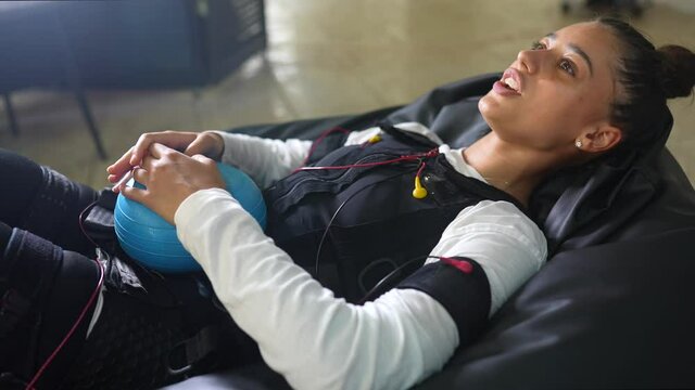 EMS training. The girl lies in a suit with cables.