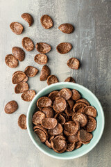 Sweet chocolate breakfast cereal flakes in bowl.