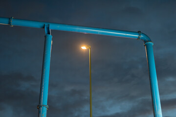 Gate from a water pipe with a street light 