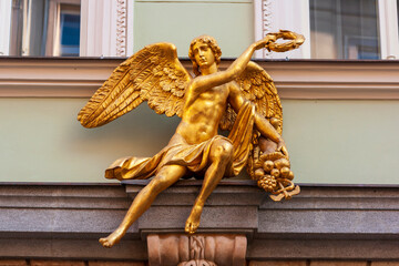 Prague, Czech Republic. Gold statue of Mercury (Hermes) with laurel wreath and caduceus.