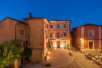 Europe, France, Roussillon. Night scene of town square.