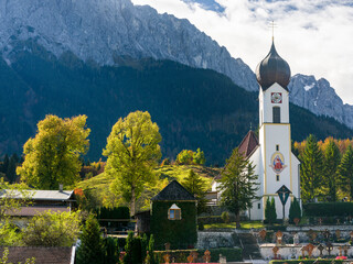 Church St. Johannes der Taufer (John the Baptist), Mount Zugspitze in the background. Village...