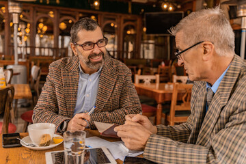 Thinking a lot about the plans and smiling in the cafe