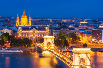 Fototapeta premium Hungary, Budapest. Szechenyi Chain Bridge across the Danube River. illuminated at night, built between 1839-49 it is supported by two towers and stretches 1,250 ft (390 meter).
