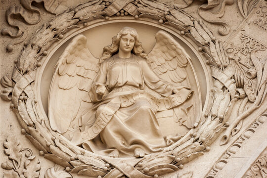 Hungary, Budapest. Architectural detail, relief of angel with banner reading 'Gloria In Excelsis Deo', 'Glory to God in the Highest'.