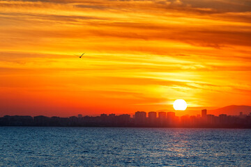 Naklejka premium Sunset landscape of Mersin coast. Mersin is the provincial capital of the eponymous Mersin Province of Turkey. It has a hot-summer Mediterranean climate a type of subtropical climate with hot.