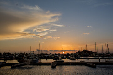Scenic view of a port in Santa Marta, Colombia during the sunset - obrazy, fototapety, plakaty