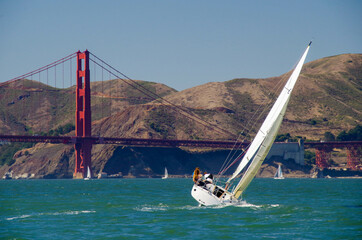 White boat sailing near the Golden Gate Bridge in San Francisco