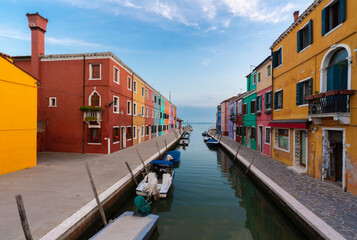 Europe, Italy, Venice. Houses and boats on canal in Burano.