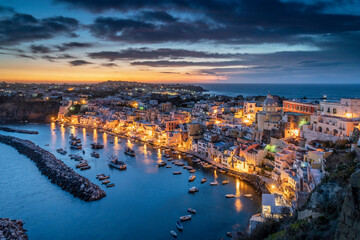 Europe, Italy, Procida. Overview of city and Marina Corricella at sunset.
