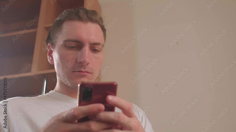Poster close-up of a man with a phone in his hands. overuse of smartphone can result in a number of differe