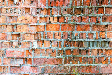 Very old and damaged brick wall texture, broken red brick background